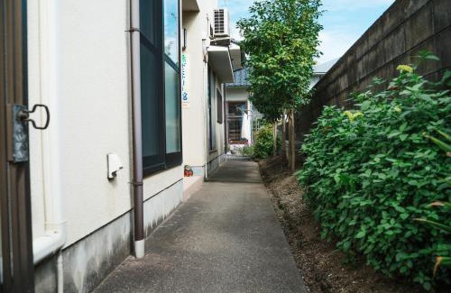 Hoshinooka House | 木の家ゲストハウス松山本館