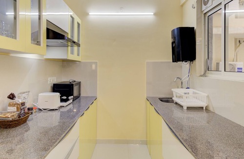 Chicalim Apartment | 5 mins to GOI airport! Family sized Apt with deck. Access to Pool, Sauna & more.