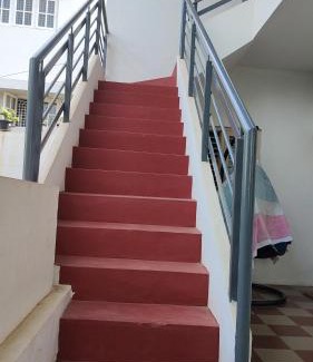 Vijayanagar House | A spacious AC room with wide Balcony -Karimbumel House a perfect place for yoga practicioners