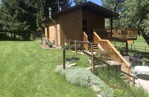 Hyrum Cabin | A wonderful, secluded 2 story cabin, deck, fire pit, stocked pond for fishing.