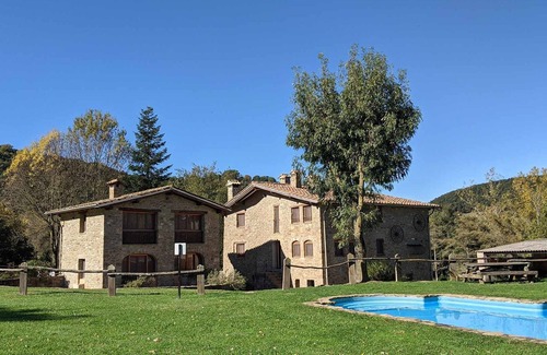 Santa Pau Apartment | Apartment 'Mas El Carrer - Groc' with Mountain View, Shared Pool and Wi-Fi