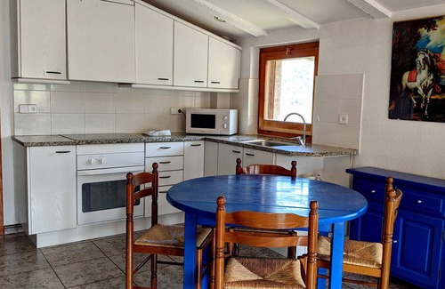Santa Pau Apartment | Apartment 'Mas El Carrer - Blau' with Shared Pool, Shared Garden and Wi-Fi