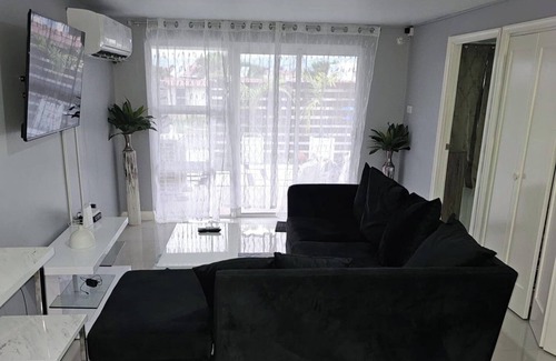 Portmore Apartment | Apartment Sleeps 6 with Pool Access