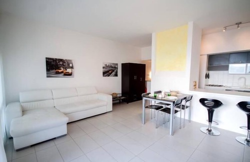 Susello Apartment | Attractive 2-room apartment with sunbath, pool and dream view
