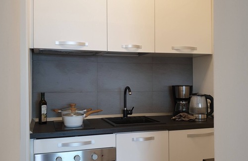 Susello Apartment | Attractive studio with terrace, garden, air conditioning, pool and dream lake view