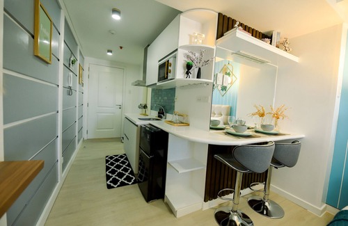 Bacolor Condo | Azure North Condo: Balcony & Scenic Views