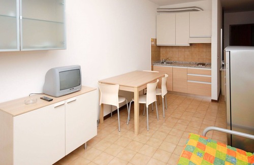 Lignano Sabbiadoro Apartment | Beautiful apartment for 4 people with A/C, pool, TV, terrace and pets allowed