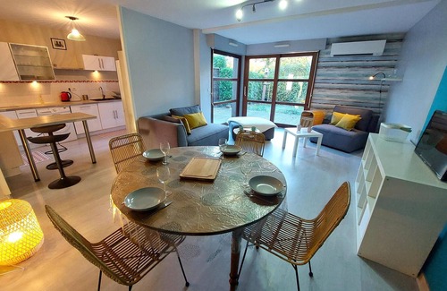 La Grand-Croix Apartment | Beautiful and modern apartment with a large window front.