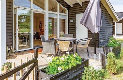 Nykøbing House | Beautiful cottage with kitchen open connection with dining and living room with an alcove.