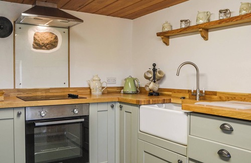 Maryport Cottage | Beautiful features with exposed stonework and beams.
