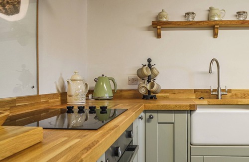 Maryport Cottage | Beautiful features with exposed stonework and beams.