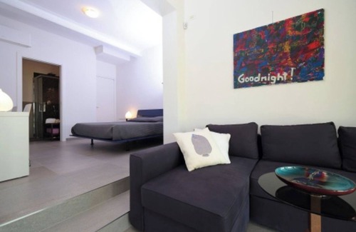 Palazzolo dello Stella Bed & Breakfast | Bed and Breakfast Loggia degli Artisti 'Quadruple Deluxe Room' with pool and air conditioning