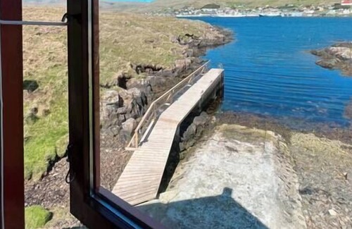 Oravik Apartment | Boathouse right by the fjord, with amazing views