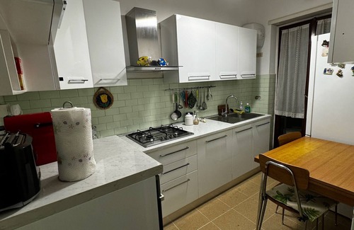 Quartiere XX Ardeatino Apartment | Bright apartment overlooking a characteristic square