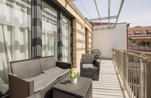 Ferencvaros Apartment | Bright Top Floor Home with Parking