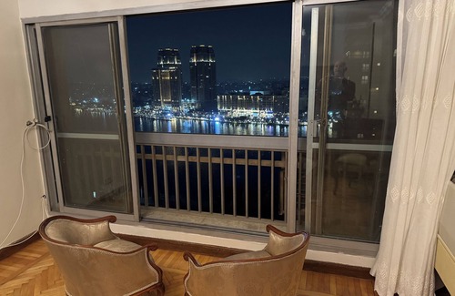 Zamalek Apartment | Cairo panoramic Nile window has a 3-bedroom, wide reception high speed WiFi, AC.