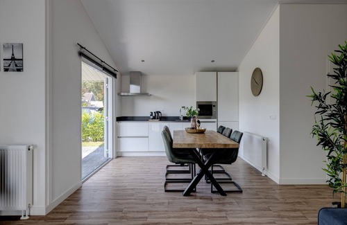 Municipality of Veldhoven Ski Chalet | Chalet by Pond in Eindhoven Holiday Park