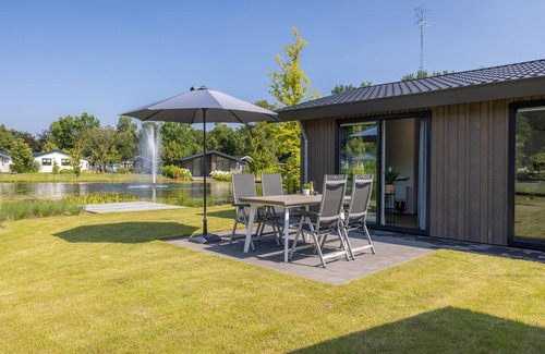 Municipality of Veldhoven Ski Chalet | Chalet by Pond in Eindhoven Holiday Park