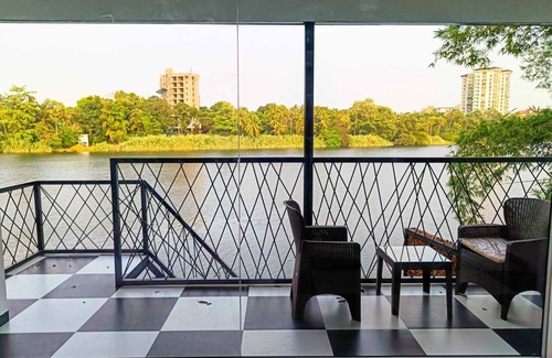 Aluva Cottage | Charming 2-bedroom cottage facing river with AC, WiFi in welcoming Aluva