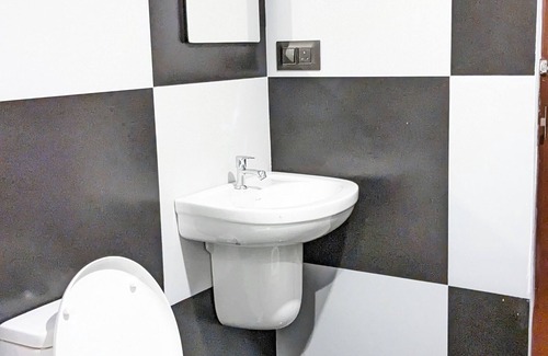 Aluva Cottage | Charming 2-bedroom cottage facing river with AC, WiFi in welcoming Aluva