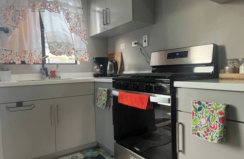 Arouca House | Charming, cozy 2-bedroom townhome in a gated community.