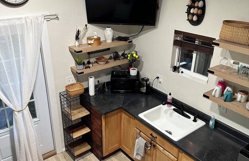 Lowell Cottage | Charming tiny house in lovely Lowell with AC, WiFi, fenced in private space