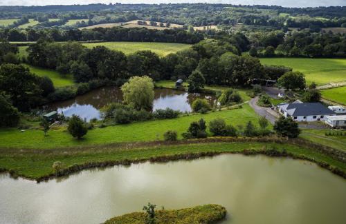 Hadlow Down House | Charming tranquil Shepherds Hut with lakeside balcony 'Roach'