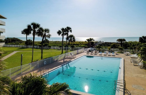 Port Canaveral Condo | Cocoa Beach Towers by Happy Palm Stays