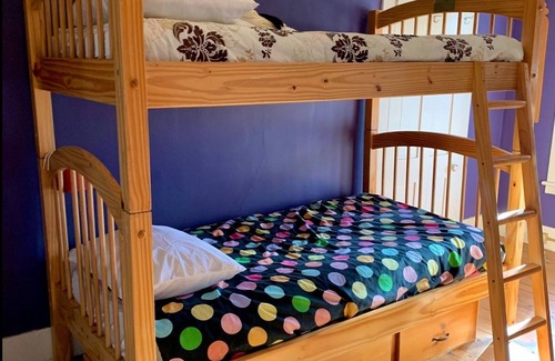 Rowe Bed & Breakfast | Colorful Bunk Bed Room, Cozy Farmhouse Retreat - Purple Dorm