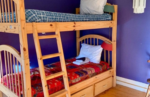 Rowe Bed & Breakfast | Colorful Bunk Bed Room, Cozy Farmhouse Retreat - Purple Dorm