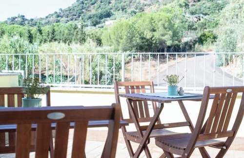 Guspini House | Comfortable room with private balcony and view