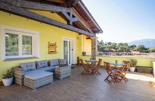 Guspini House | Comfortable room with private balcony and view