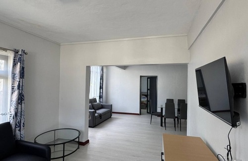 Roches Noires House | Cozy 2 bed-room house with beautiful front yard; 15 minutes to the beach.