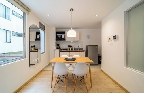 Financial District Apartment | Cozy Apartment in Zona G with Laundry Facilities