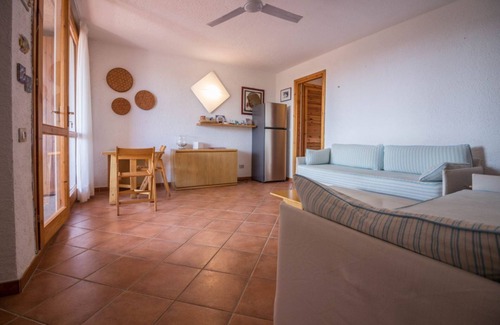 Cugnana Verde Apartment | Cozy apartment of 70 sqm with private entrance, can accommodate up to 4 people, located on the first floor within the village Cugnana Verde (no lift). The property is equipped with every comfort! Inside the Residence you will find a various services, inc