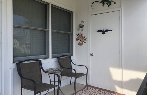 Village Green House | Cozy Beach Cottage in Island’s residential neighborhood!