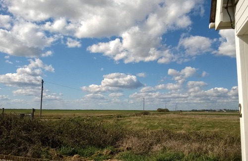 Clacton-on-Sea Ski Chalet | Cozy comfortable cottage by the sea and water, surrounded by fields and space