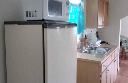 Andros Town House | Cozy cottage with AC, Washer & dryer, spacious, situated on the beach.