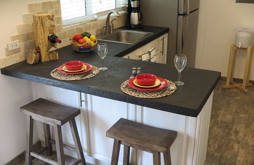 Double Bay Cottage | Cozy stone studio cottage on private pink sand beach