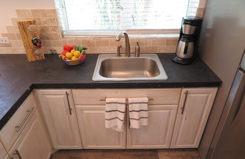 Double Bay Cottage | Cozy stone studio cottage on private pink sand beach