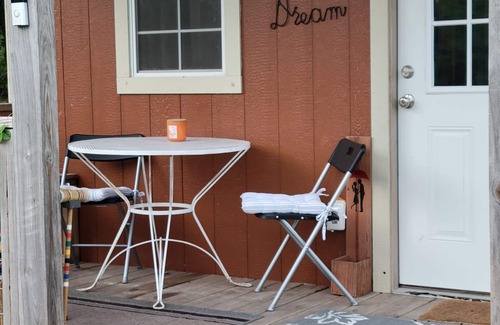 Kempner Cabin | Cozy Tiny Cabin with a small porch and firepit.
