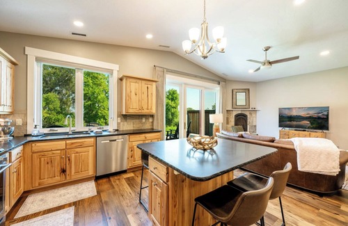 Sheridan Condo | Creekside 2BR/2BA retreat in the Powderhorn Golf Community. Steps from clubhouse, pool, and tennis courts with a private patio overlooking Goose Creek.