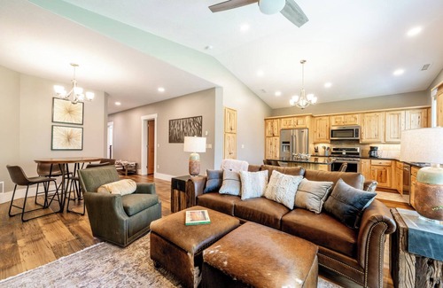 Sheridan Condo | Creekside 2BR/2BA retreat in the Powderhorn Golf Community. Steps from clubhouse, pool, and tennis courts with a private patio overlooking Goose Creek.