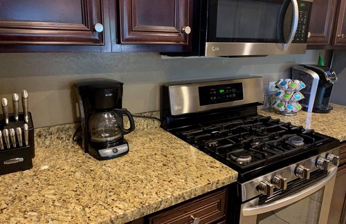 Roosevelt Park House | Custom home with 5 Beds & 5.5 Baths! A heated pool & spa make the backyard feel like a resort