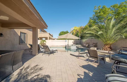 Roosevelt Park House | Custom home with 5 Beds & 5.5 Baths! A heated pool & spa make the backyard feel like a resort