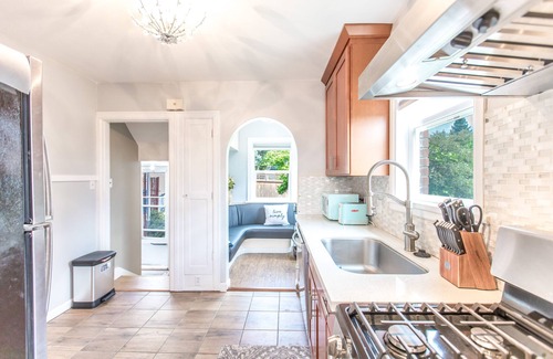 Kent House | Elegant French Tudor Retreat with Stunning City Views!