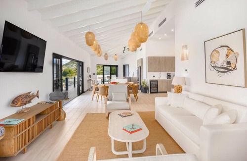 Fryes Beach Hotel | Elevated Beachside Charm with Living Area with Unmatched Caribbean Serenity