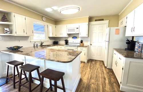 Avalon House | ENJOY BAY VIEWS! Bayfront home, shady front porch 2 boat docking areas, gameroom to watch TV, A short bike ride or walk to Avalon's fine business district for ice cream, dining, mini golf, shopping and more.