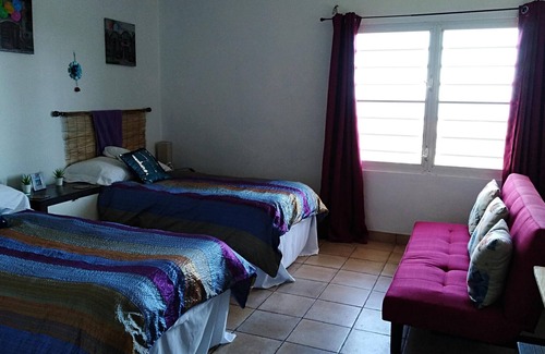 Tejas House | Enjoy ocean views and breezes as you relax in one of the hammocks on the deck