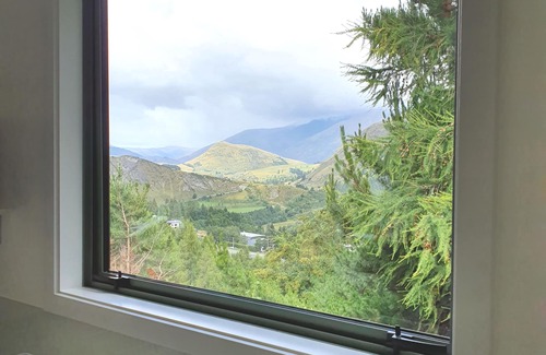 Arthur's Point Ski Chalet | Entire 2 bedroom detached chalet, in private woodland with valley views.